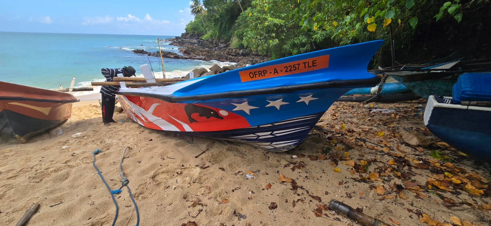 Colourful fishing boat resting on Tangalle beach