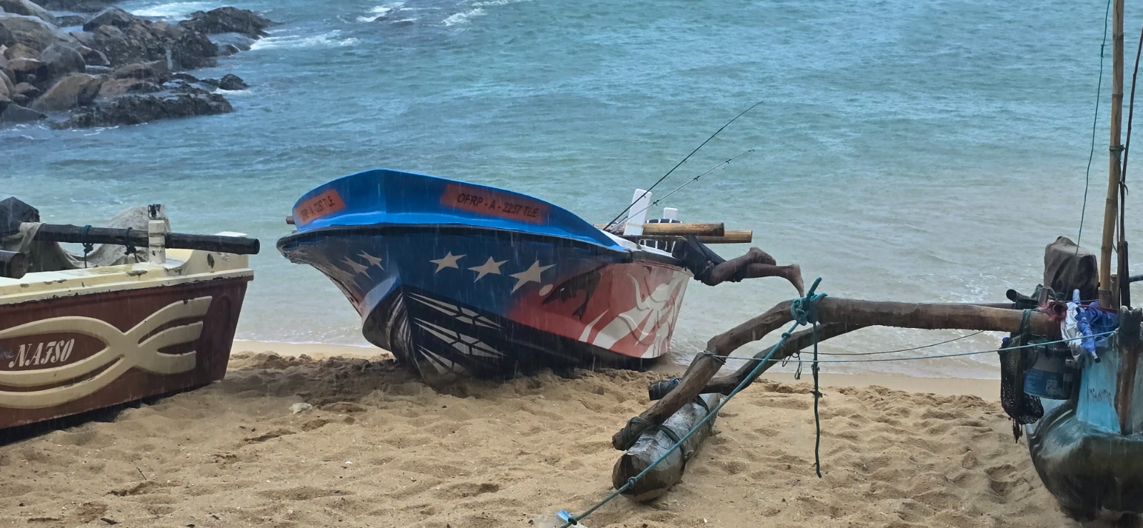 Traditional fishing boats pulled up on Tangalle beach